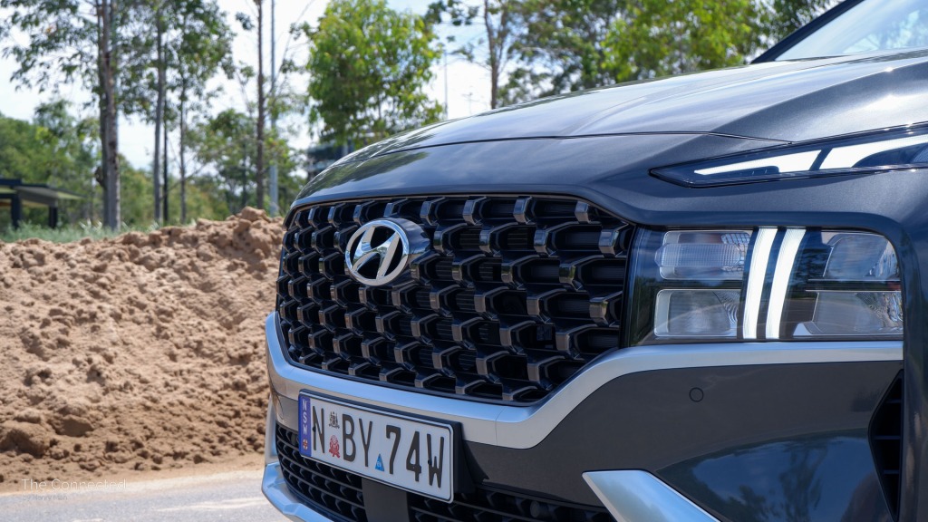 Hyundai Santa Fe Hybrid front grille and daytime running lights in front of sand pit