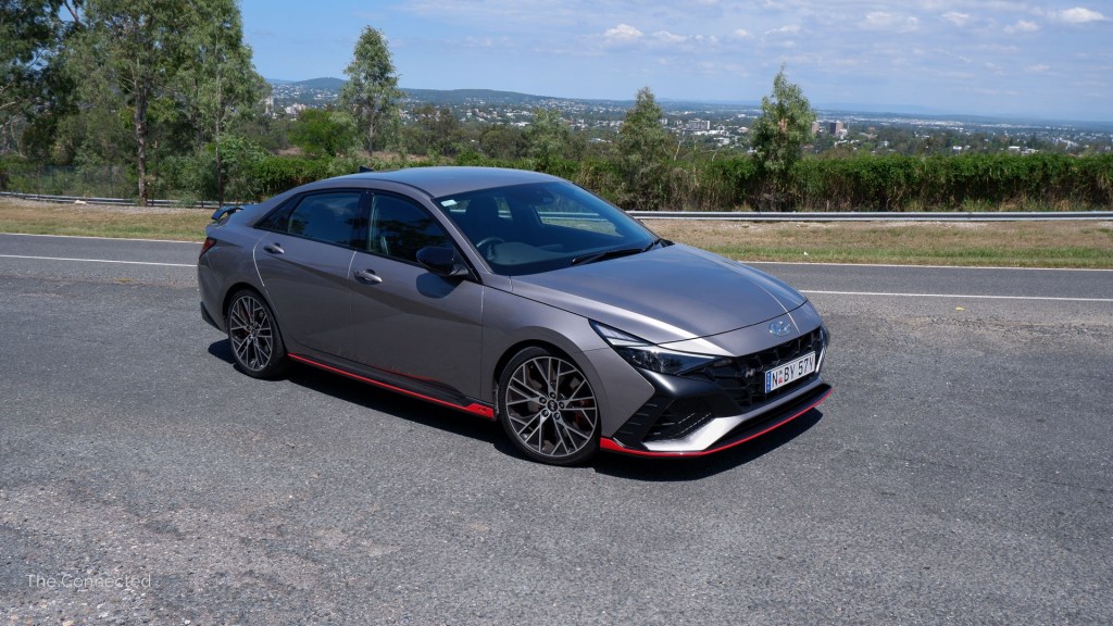 Hyundai i30 Sedan N front three-quarter view at mountain road