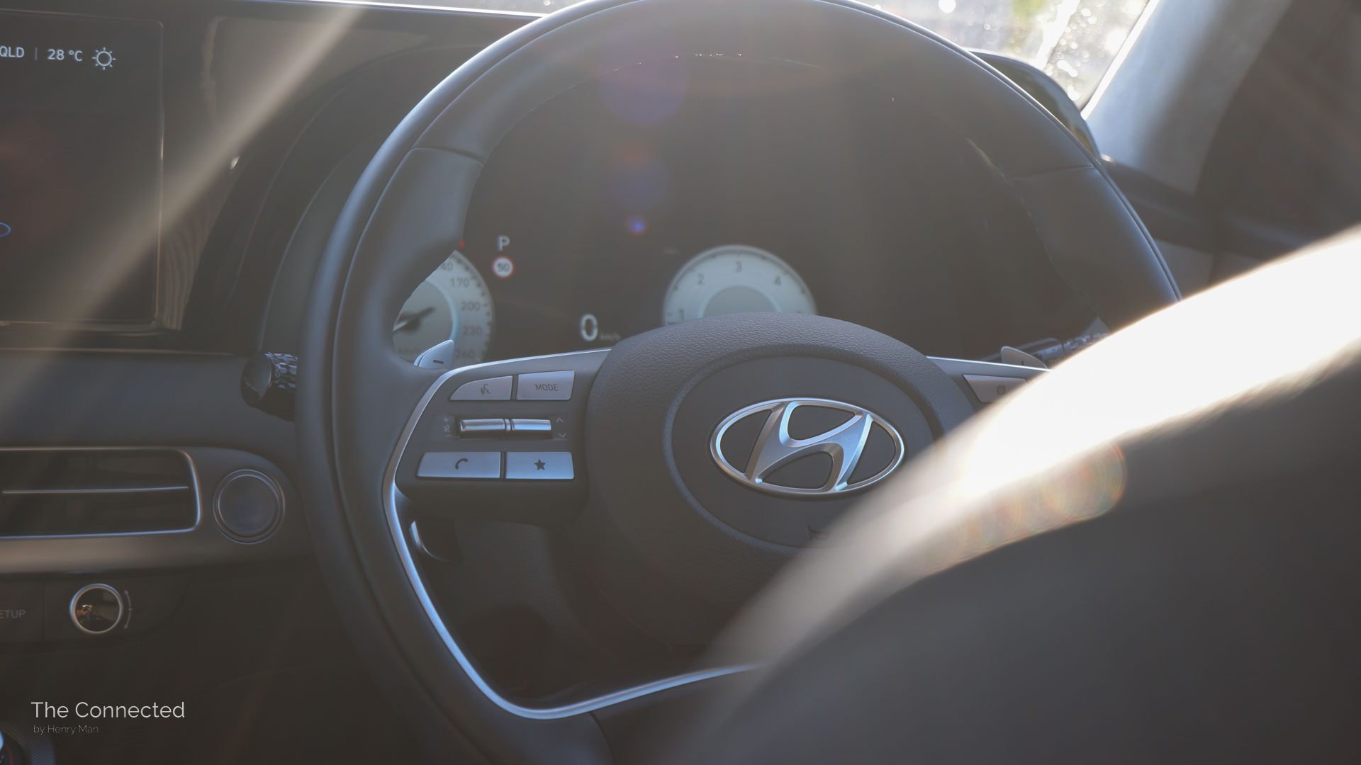 Hyundai Palisade Highlander steering wheel in sunset
