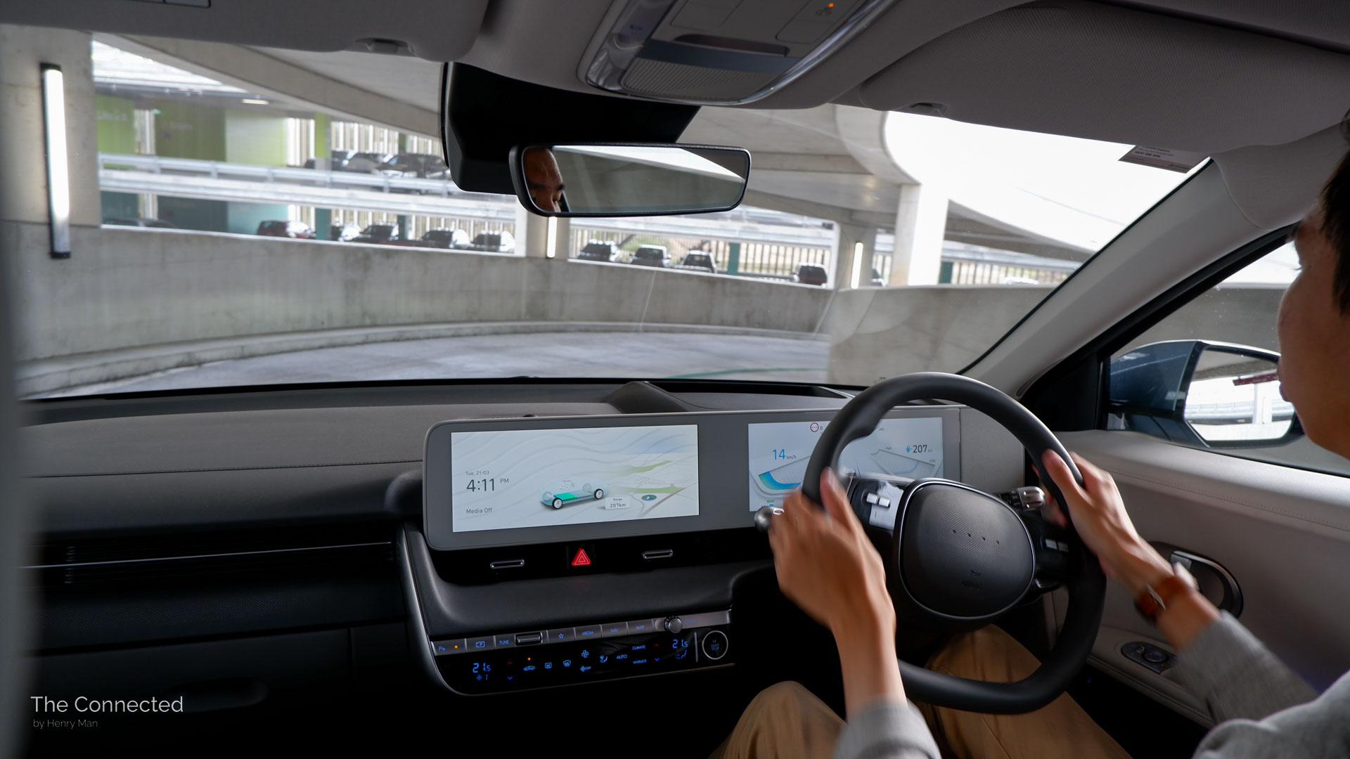Man driving Hyundai Ioniq 5 down multi-level car park