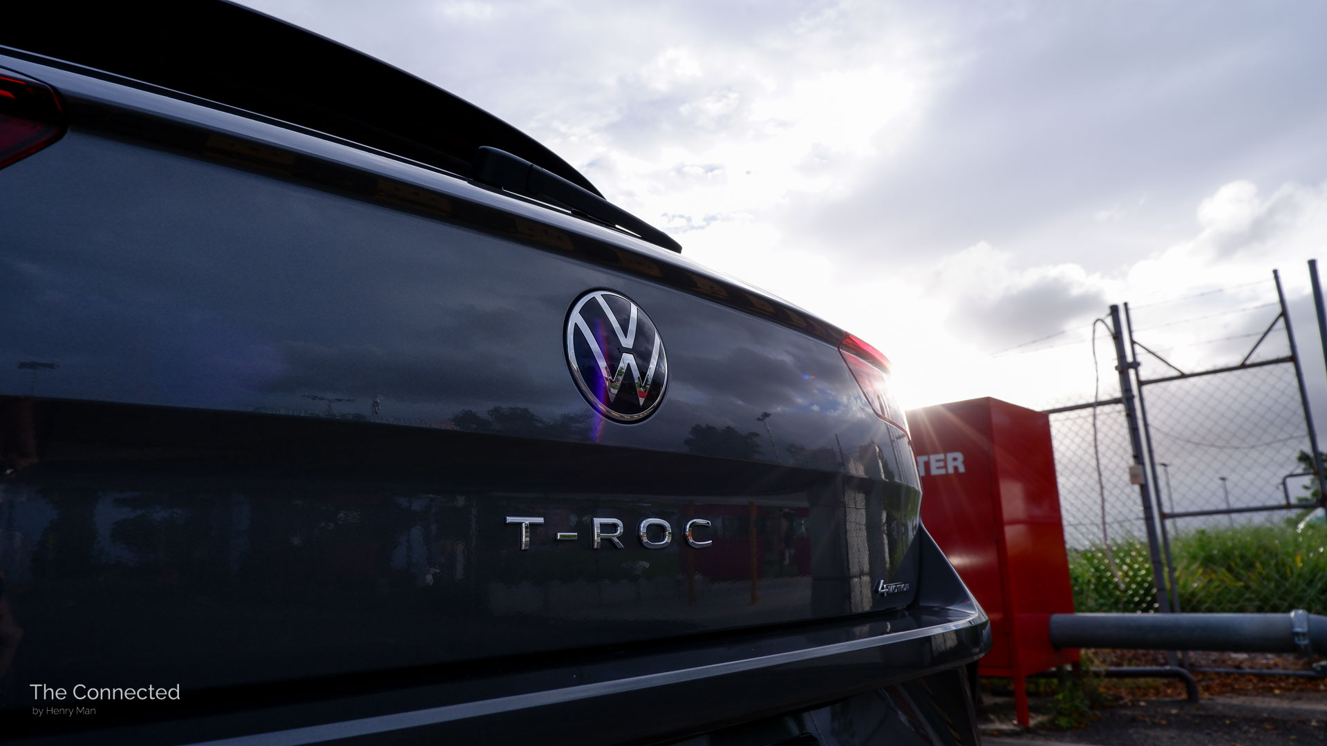 Volkswagen T-Roc rear tailgate logo and badge in sunset