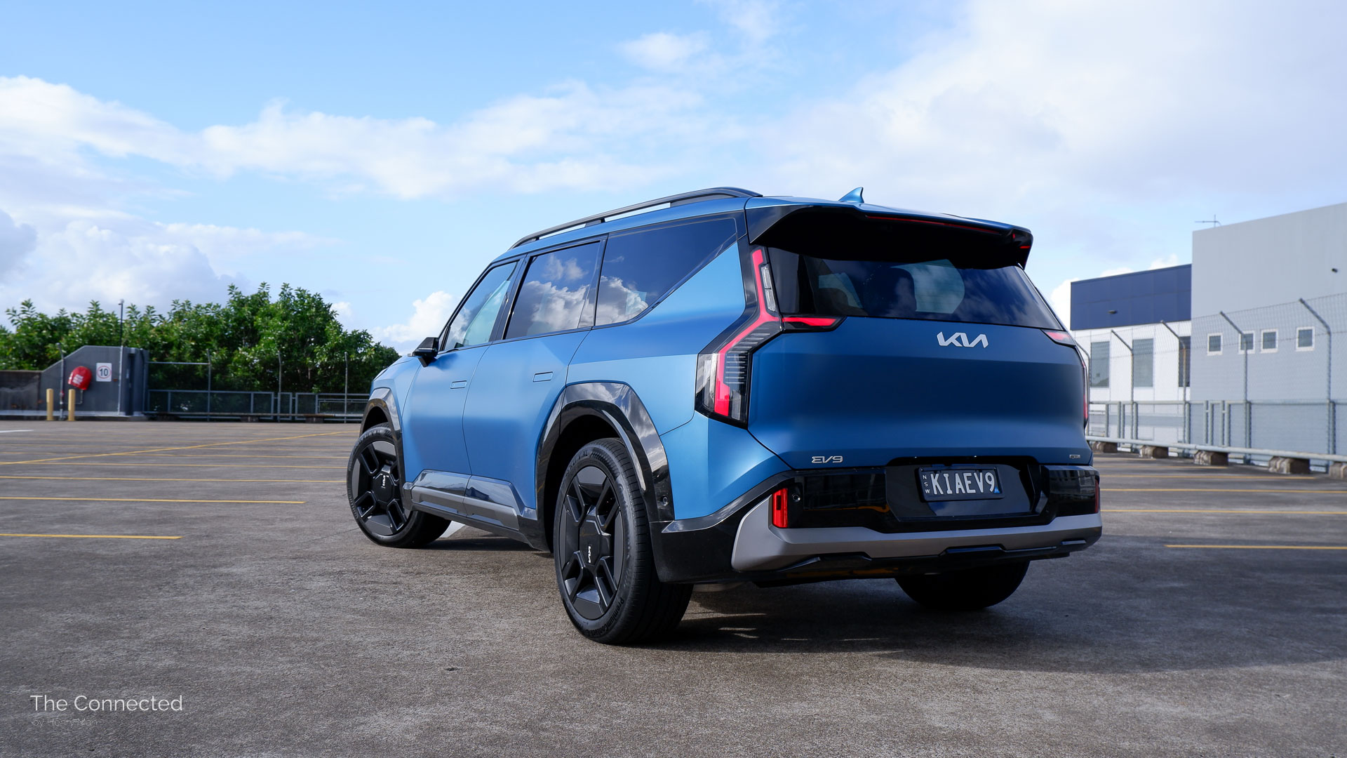 Kia EV9 rear-quarter view at car park