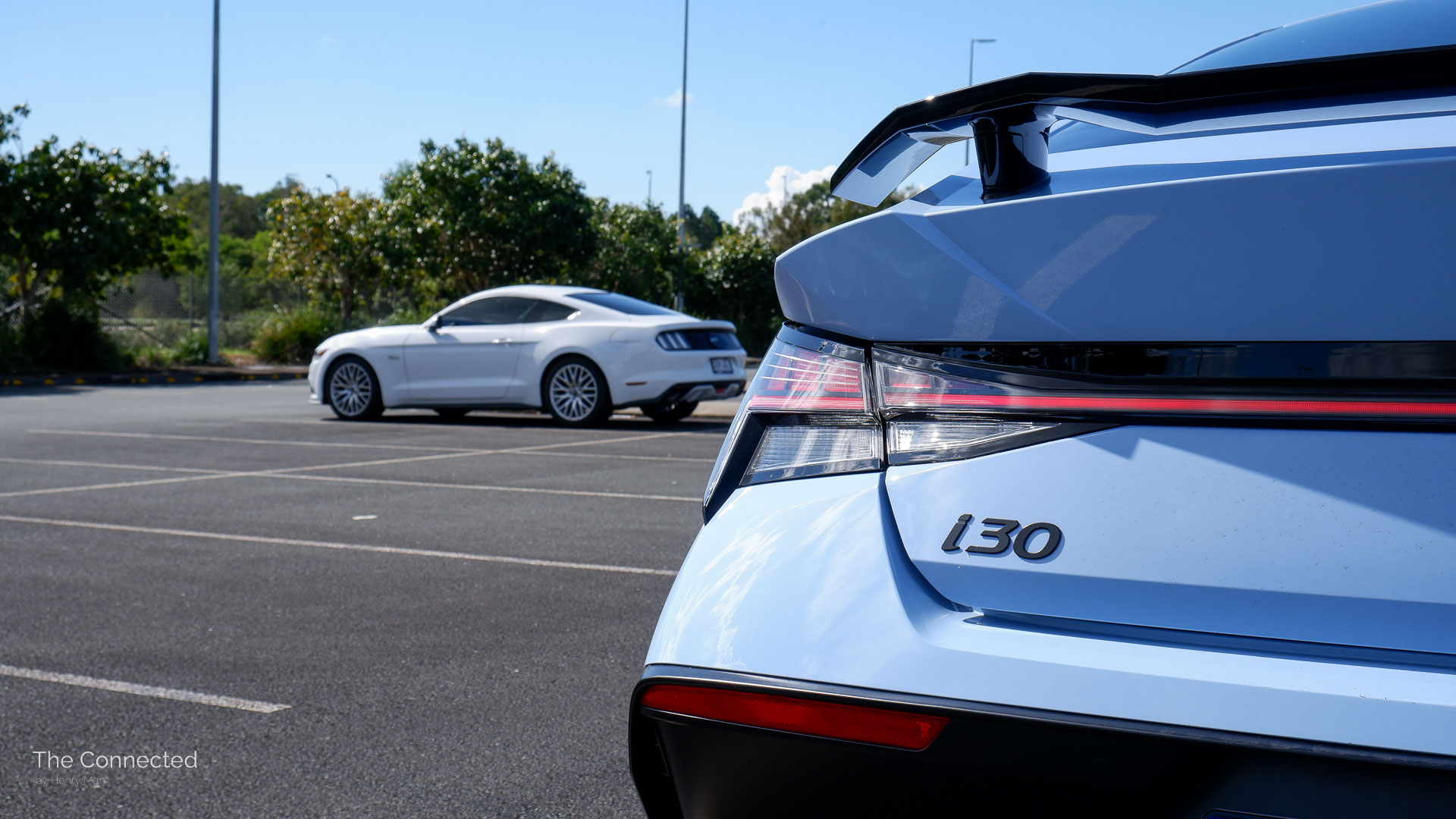 Hyundai i30 Sedan N in front of Ford Mustang