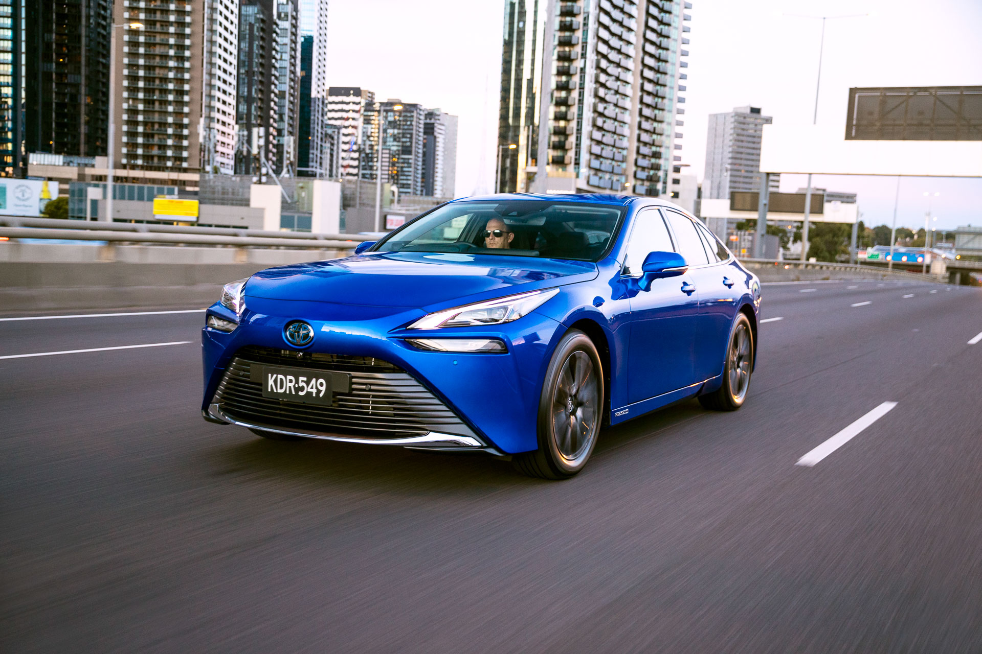 Toyota Mirai driving on city highway