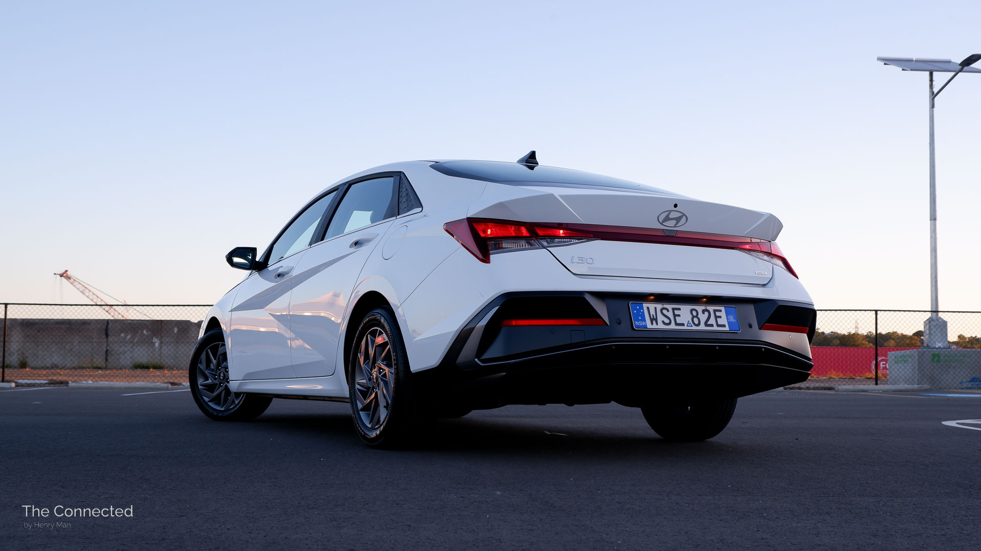 2025 Hyundai i30 Sedan rear-quarter view in sunset