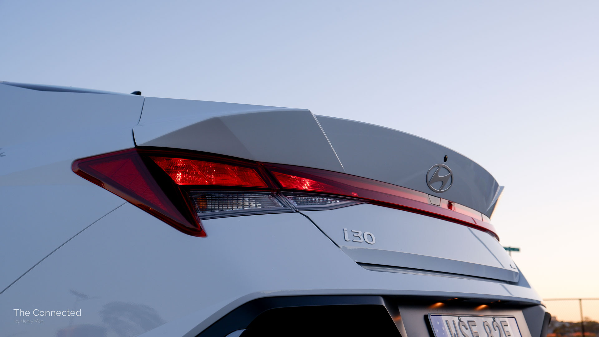 2025 Hyundai i30 Sedan rear tail-light in front of sunset