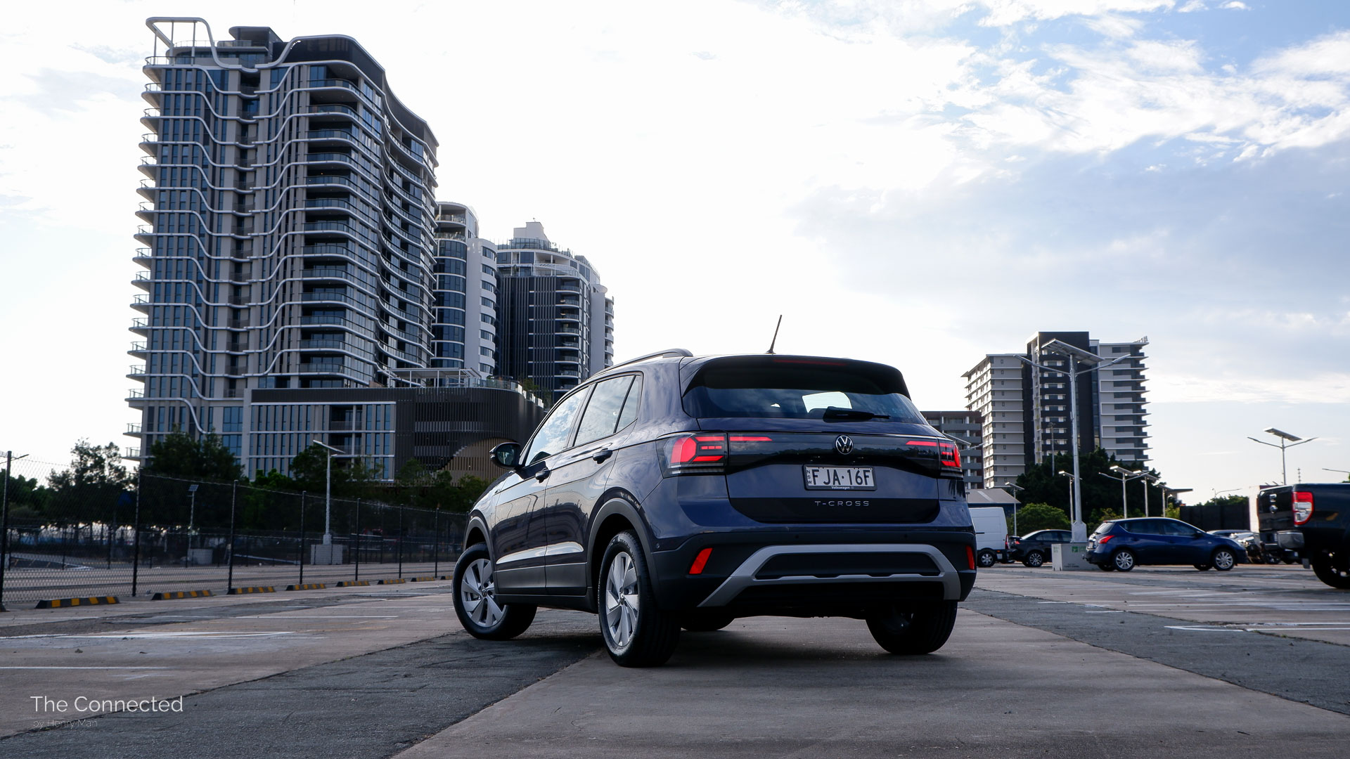 2025 Volkswagen T-Cross Life rear quarter view in front of apartments