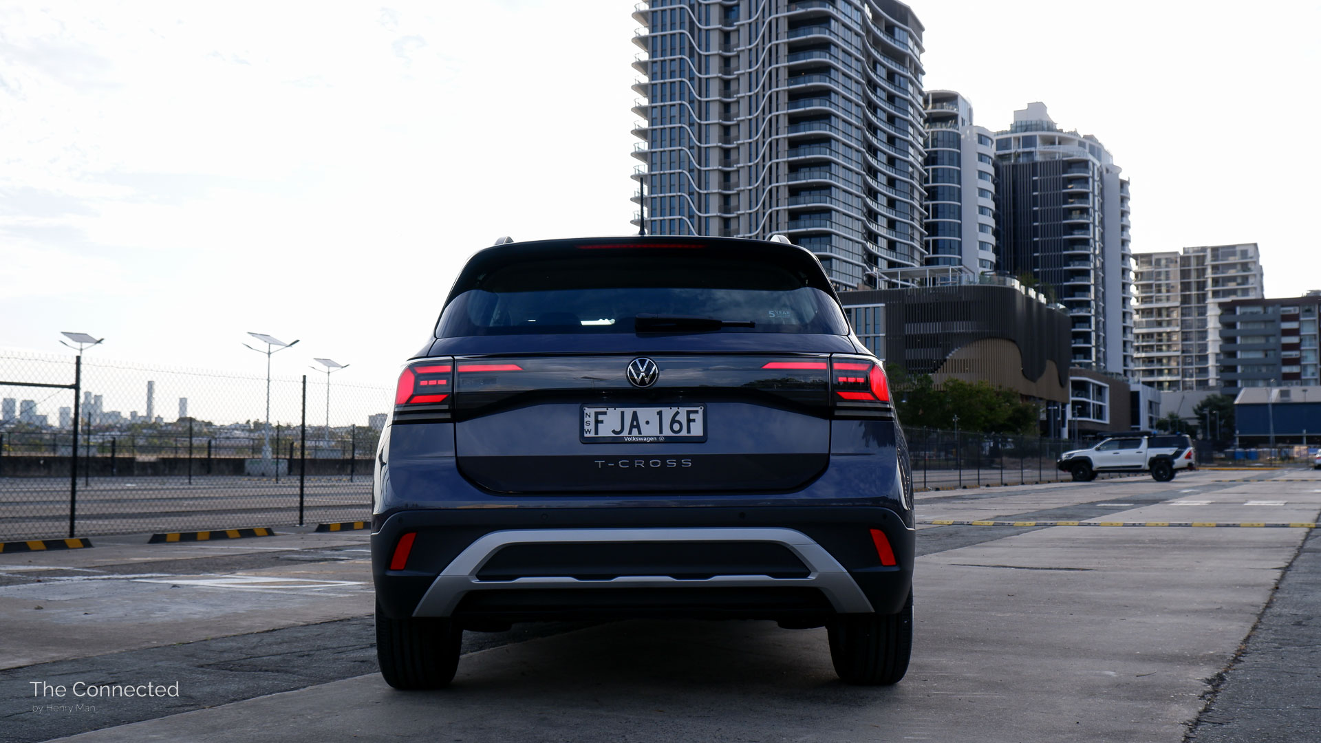 2025 Volkswagen T-Cross Life rear in front of apartments