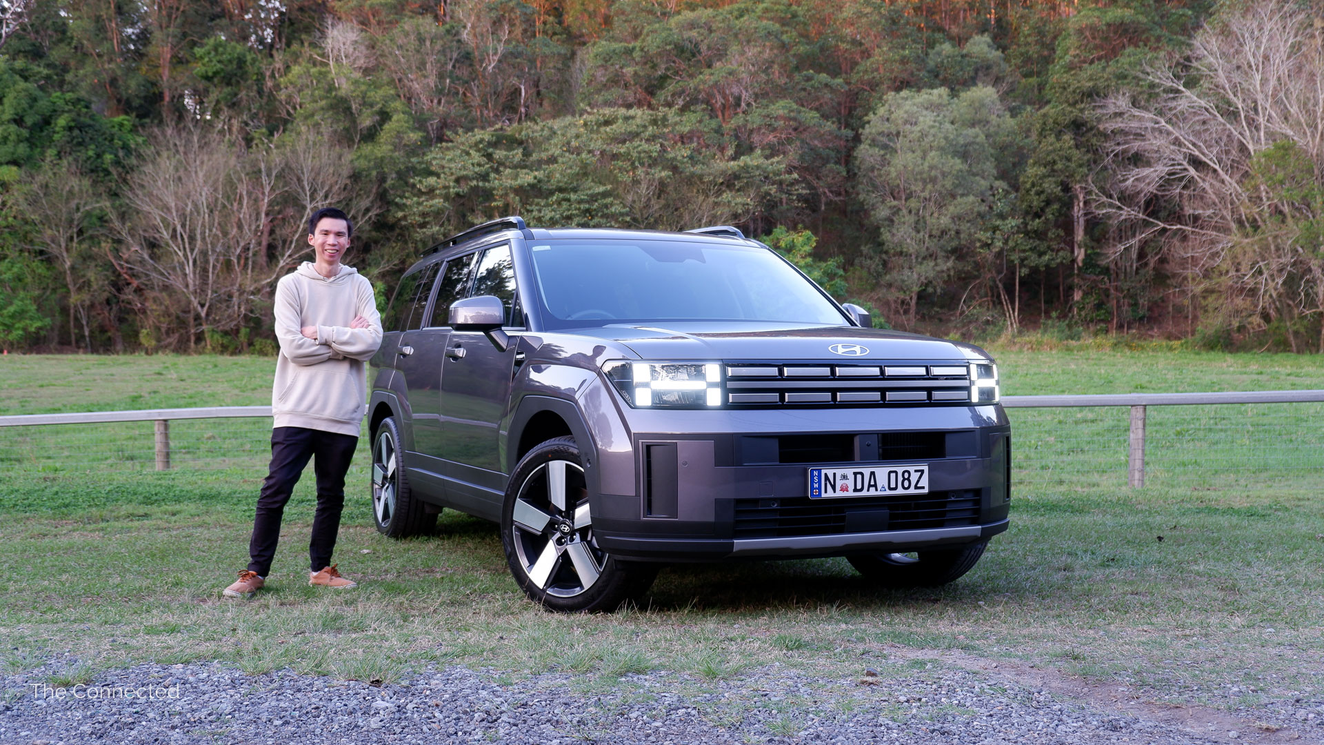 Henry Man standing next to 2025 Hyundai Santa Fe Hybrid