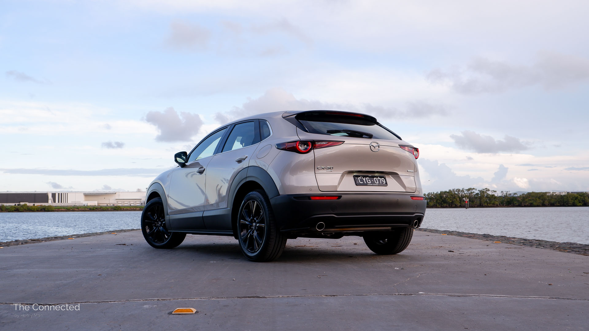 2025 Mazda CX-30 GT SP rear-quarter view in front of river