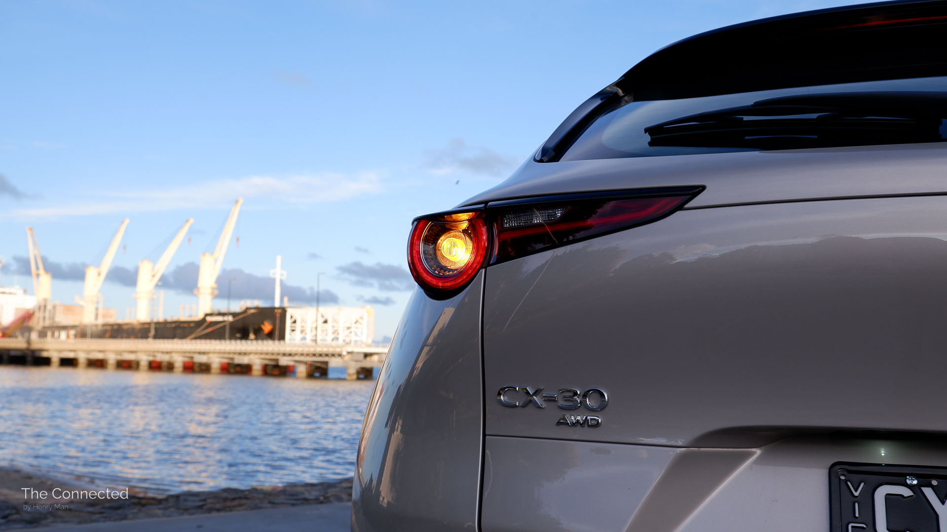 2025 Mazda CX-30 GT SP rear left tail-light and CX-30 AWD badge