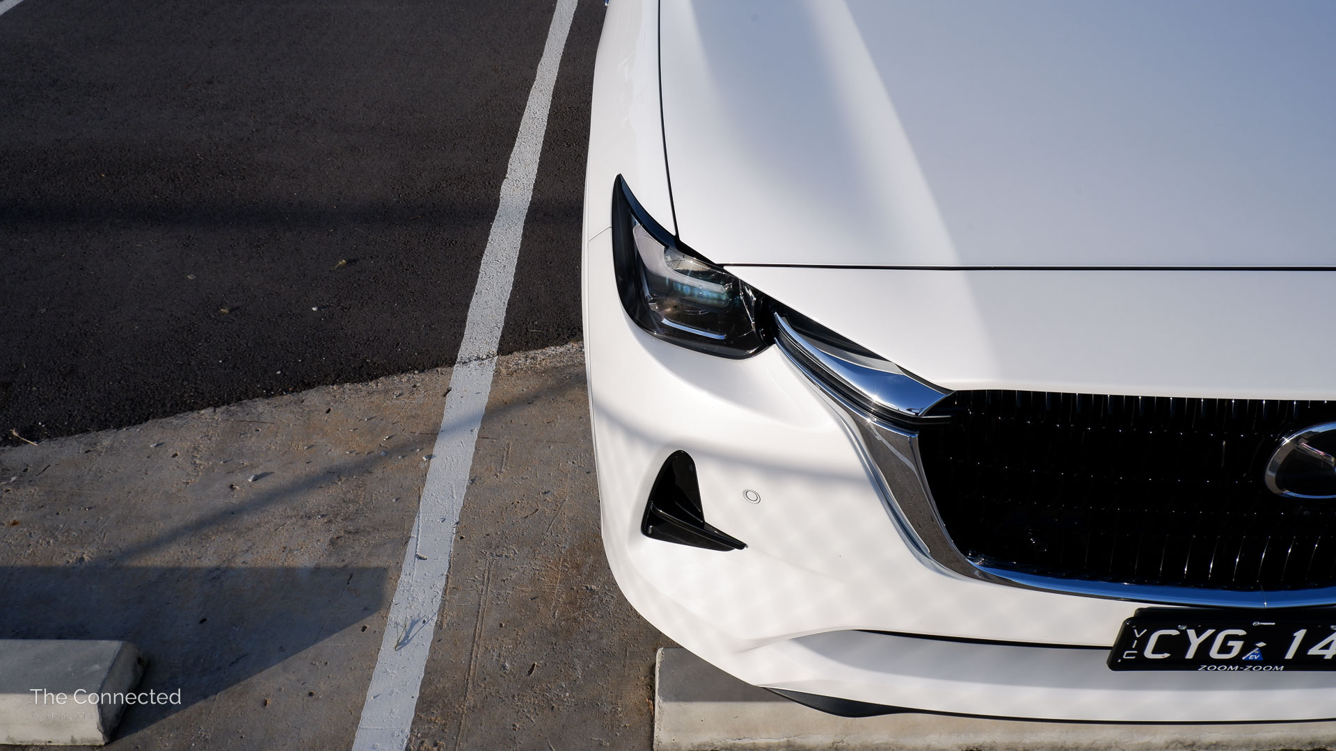 2024 Mazda CX-60 front bonnet and headlight in sunset