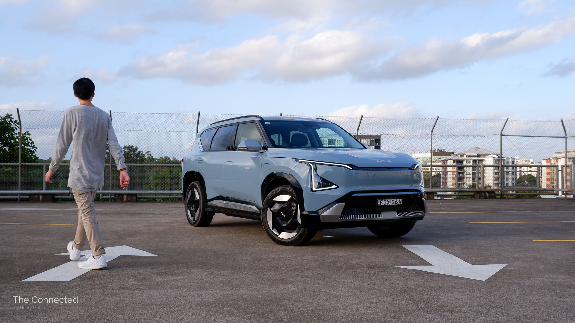 Man walks past the 2025 Kia EV5 Earth at rooftop