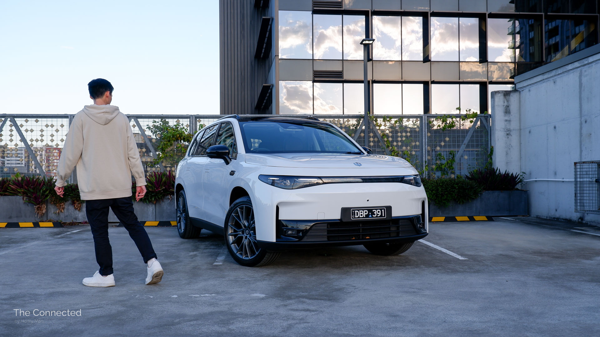 Man walks past 2025 Leapmotor C10 BEV in city car park