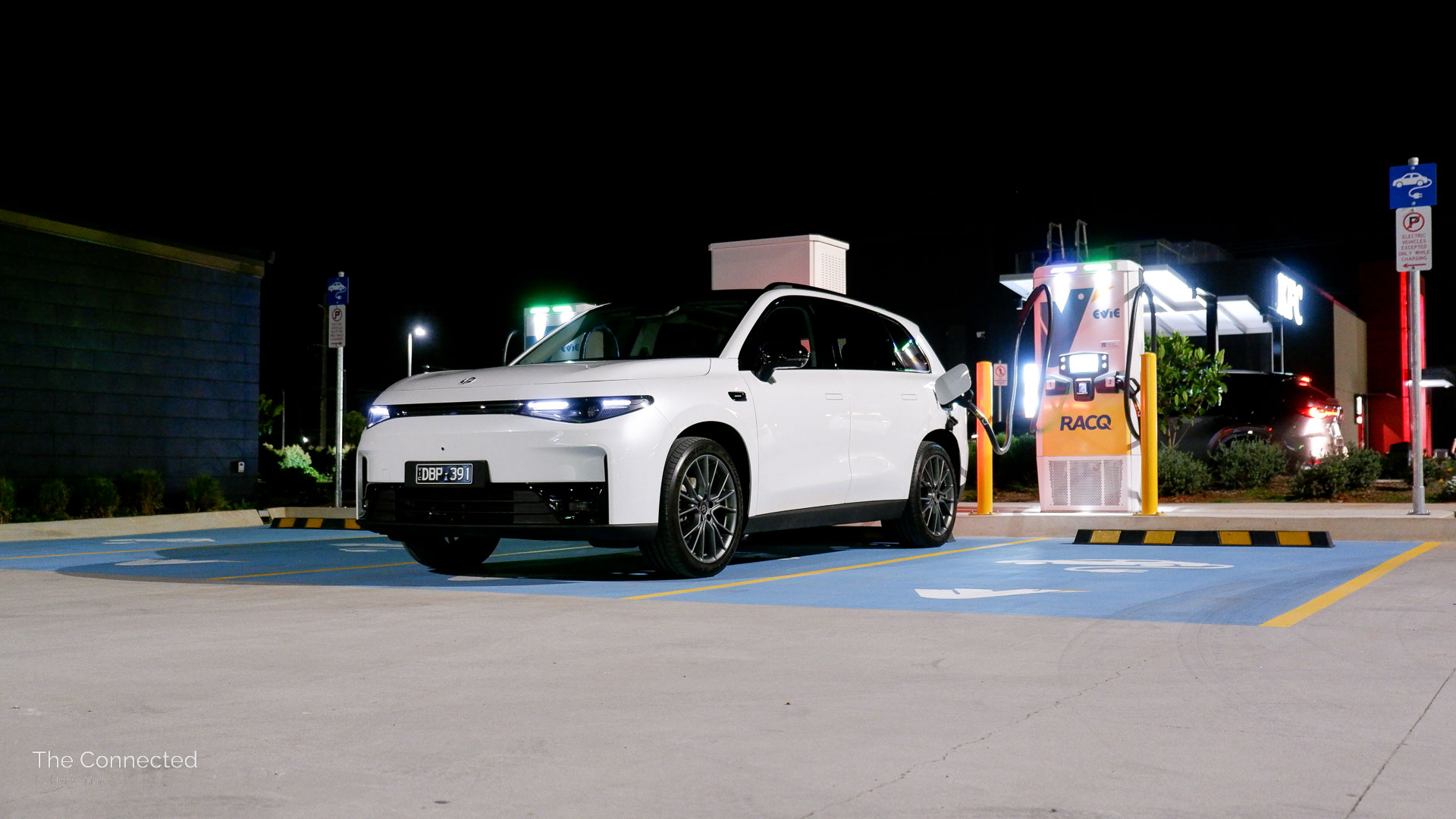 2025 Leapmotor C10 BEV at public Evie fast charging station during the night
