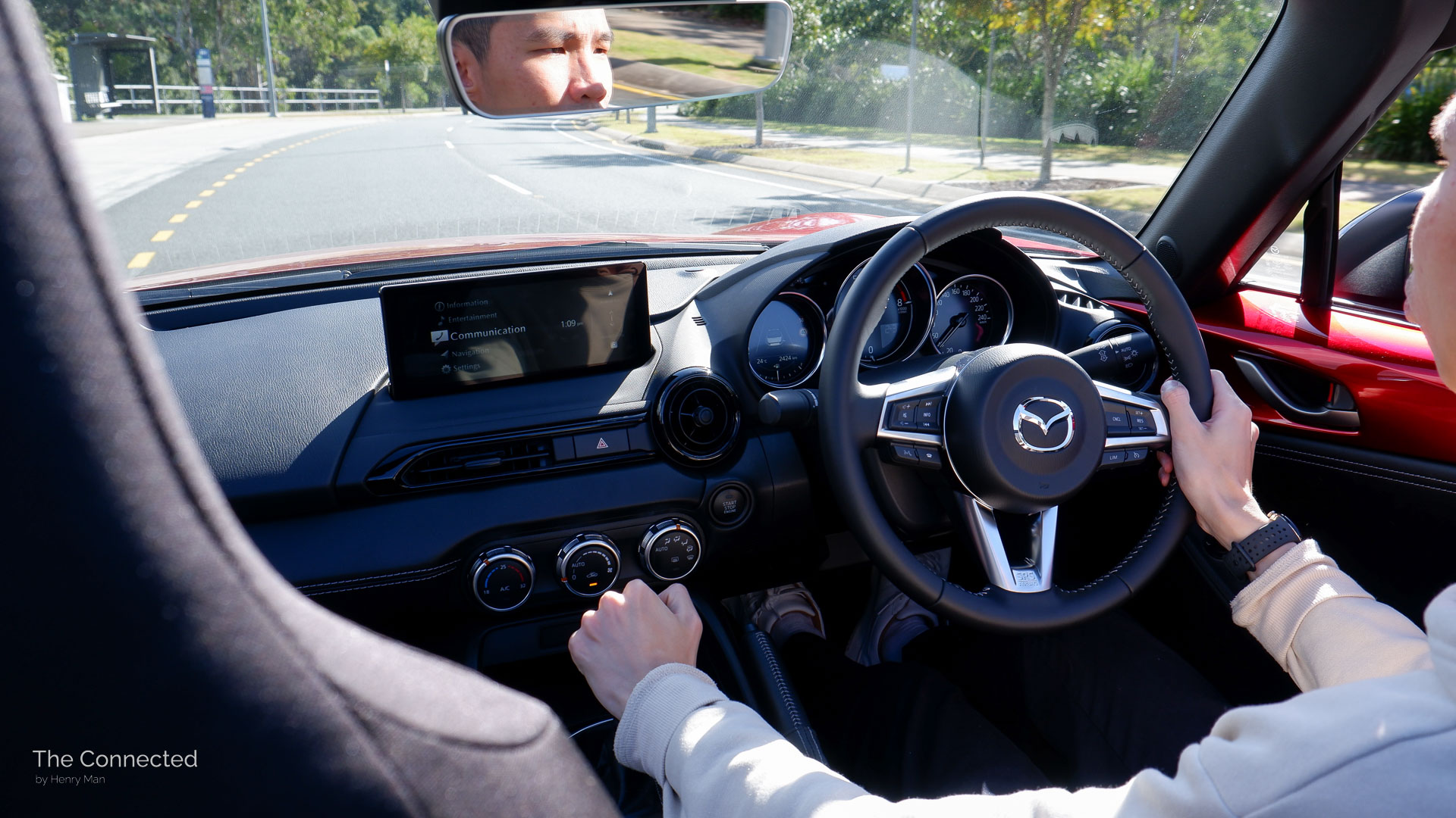 Man driving 2026 Mazda MX-5 G20 Roadster and shifting gears