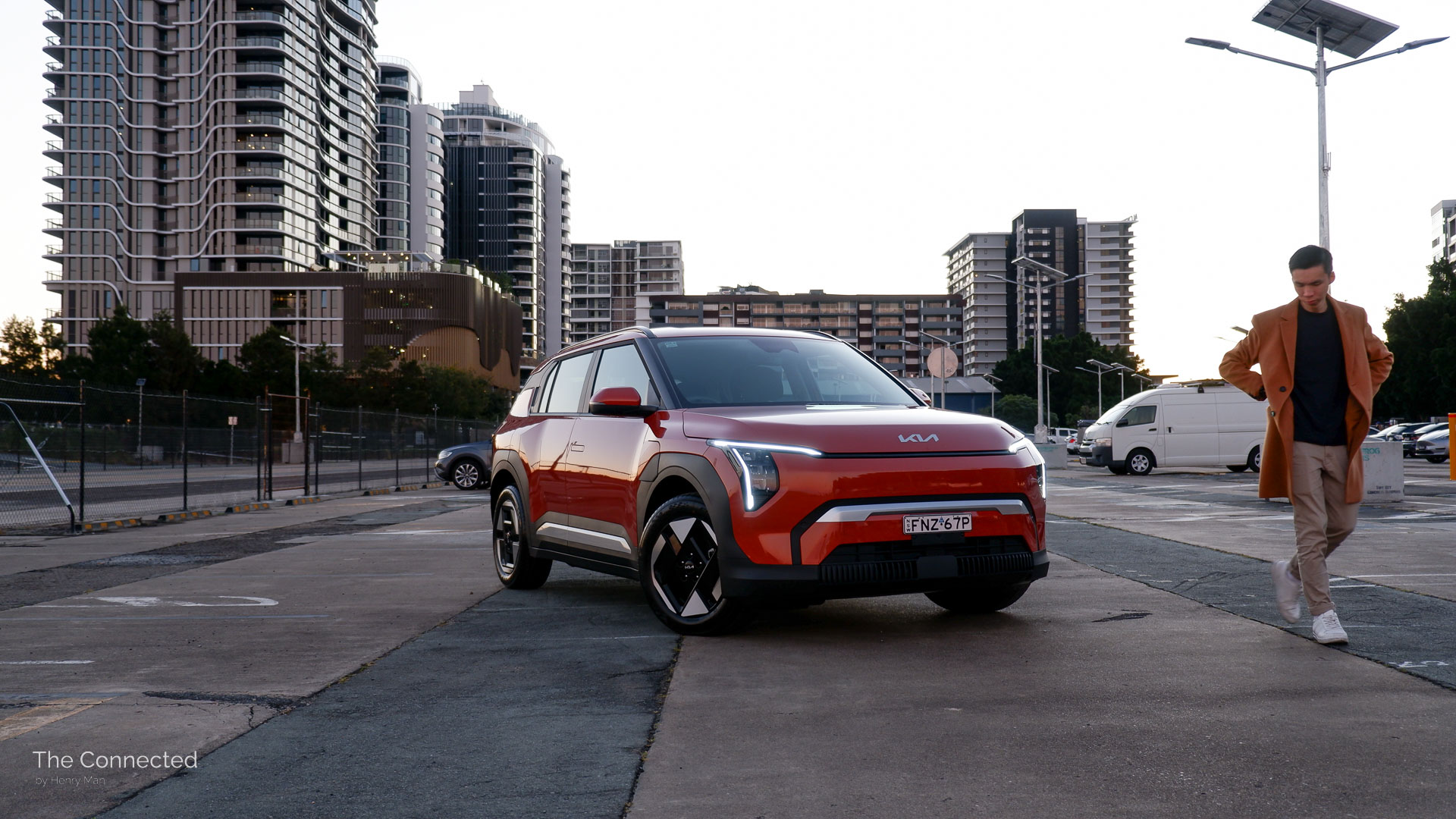 Man walks past the 2026 Kia EV3 Air in a car park