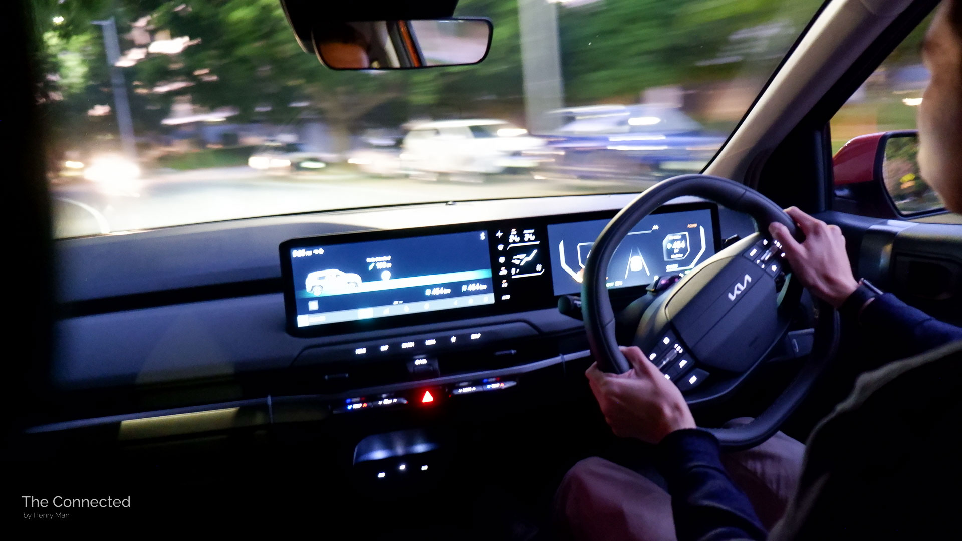 Man driving 2026 Kia EV3 at night