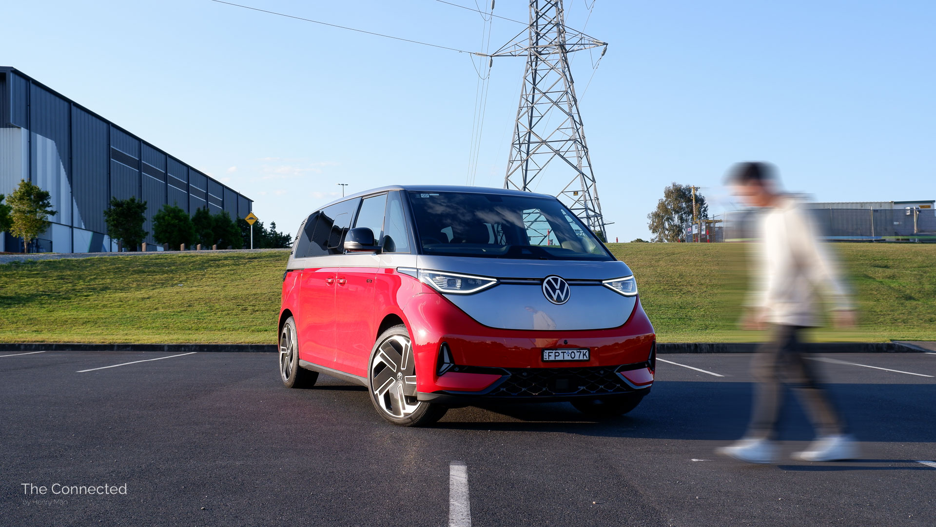 Man walks past 2026 Volkswagen ID.Buzz GTX LWB with a power line behind