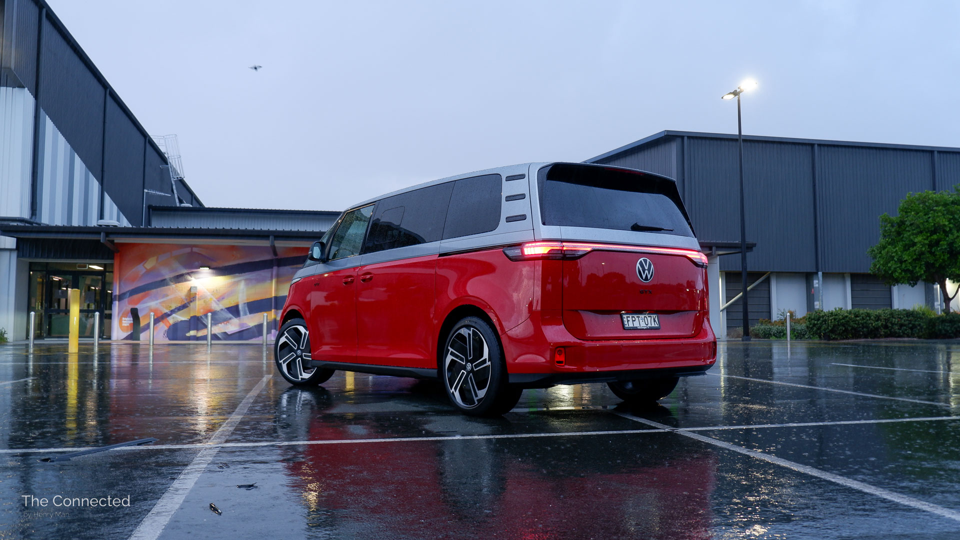 2026 Volkswagen ID.Buzz GTX LWB rear-quarter in the rain