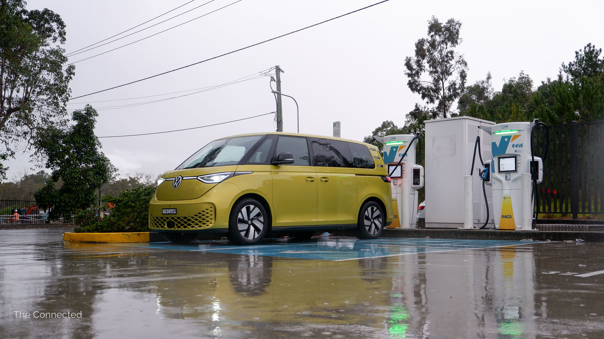 2026 Volkswagen ID.Buzz Pro SWB charging in the rain at an ultra-fast Evie public charging station