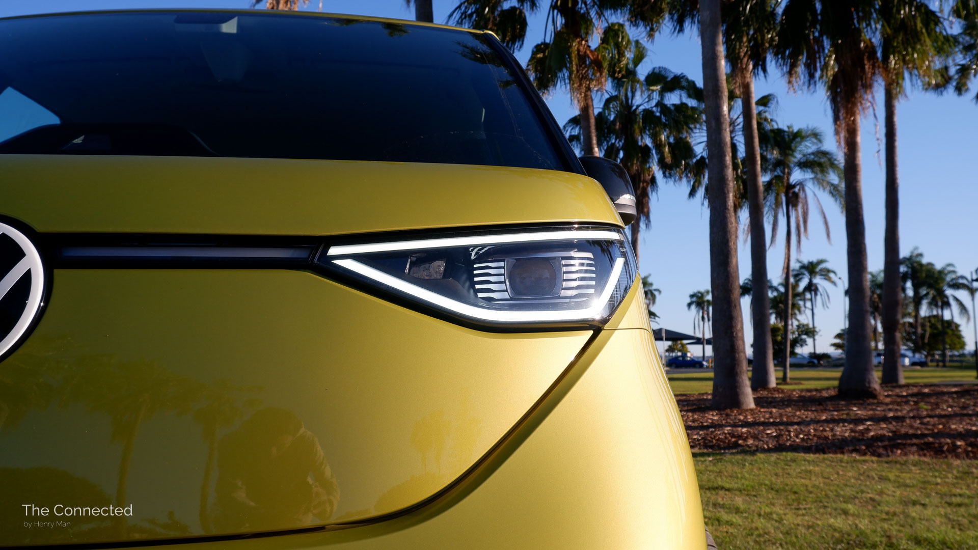 2026 Volkswagen ID.Buzz Pro SWB front LED daytime running light with palm trees behind