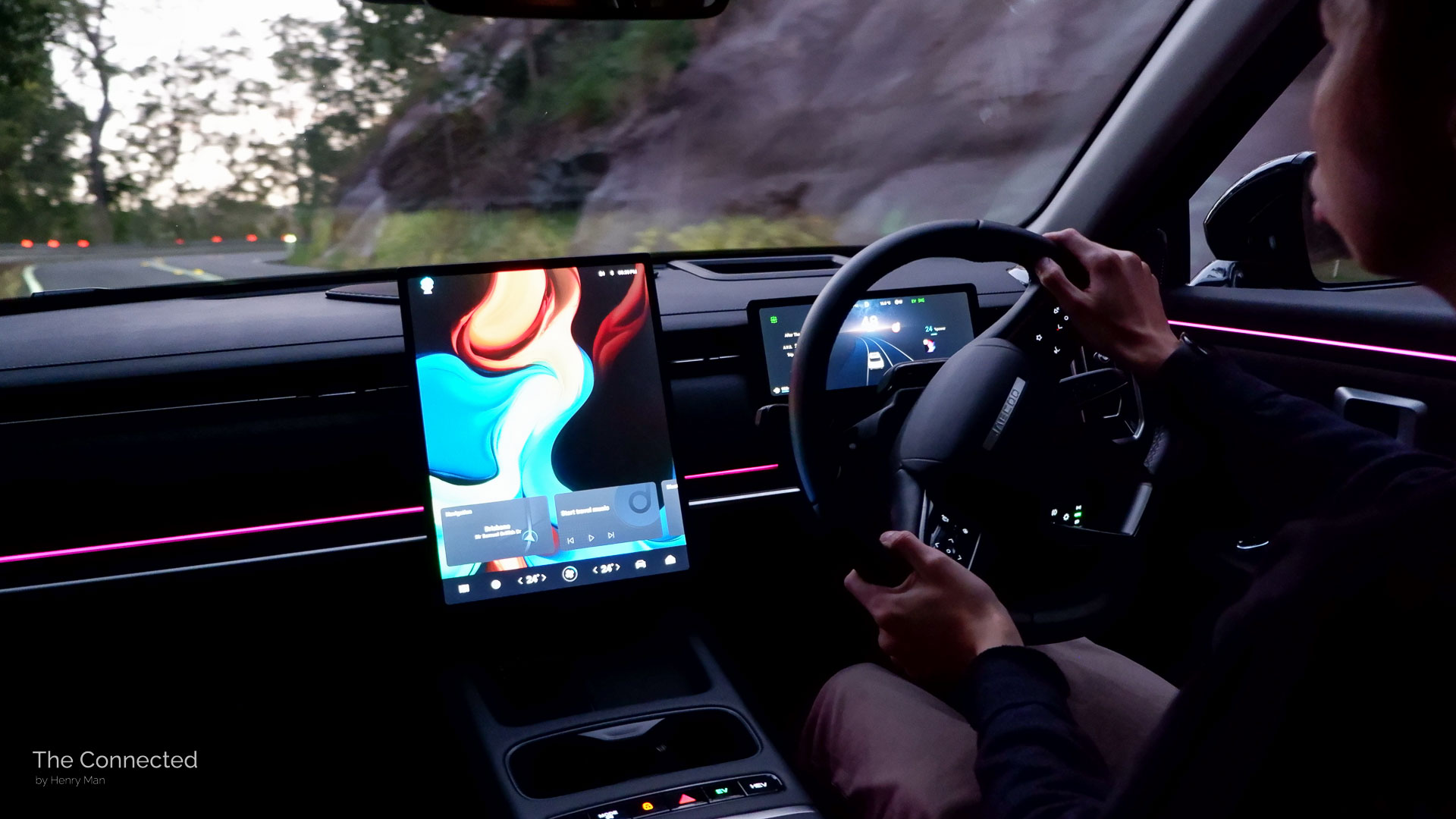 Man driving 2026 Jaecoo J7 SHS Summit at night around mountain bend