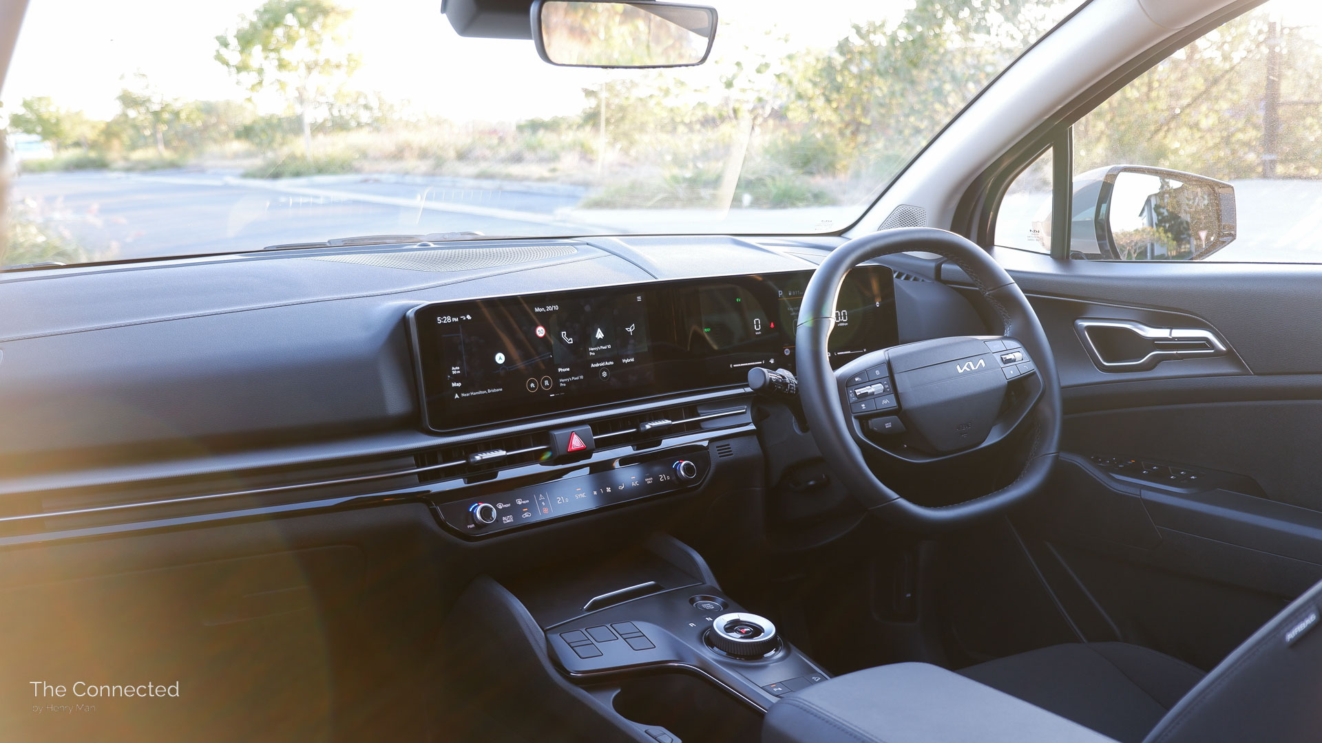 2026 Kia Sportage SX Hybrid interior and dashboard in the sunset