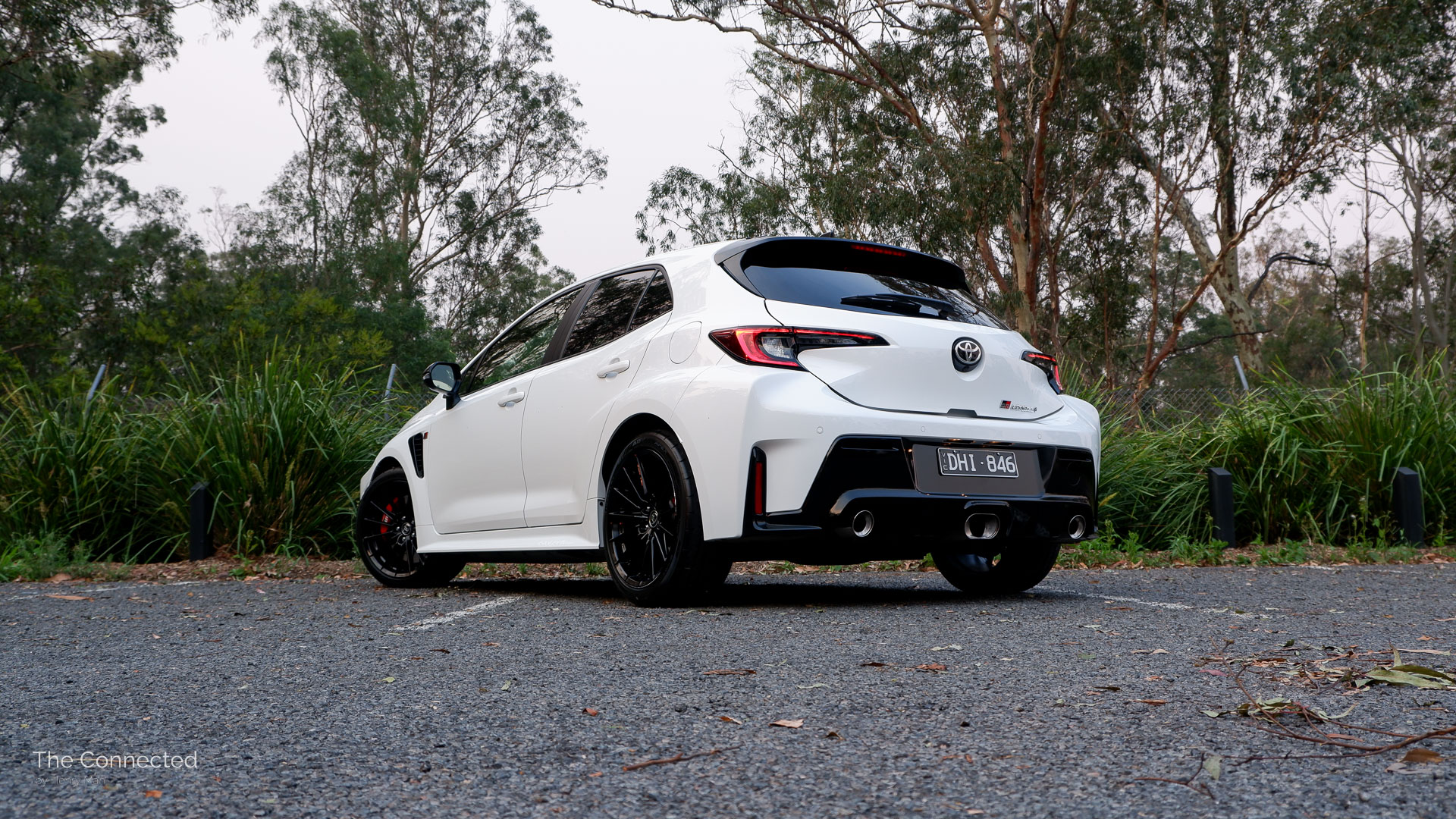 2026 Toyota GR Corolla GTS rear-quarter view in front of forest