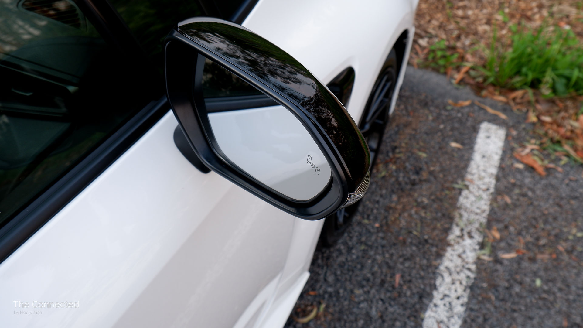 2026 Toyota GR Corolla GTS wing mirror with blind-spot alert icon