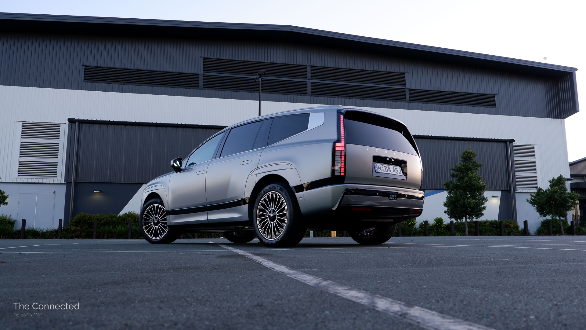 2026 Hyundai Ioniq 9 Calligraphy rear-quarter view during the sunset