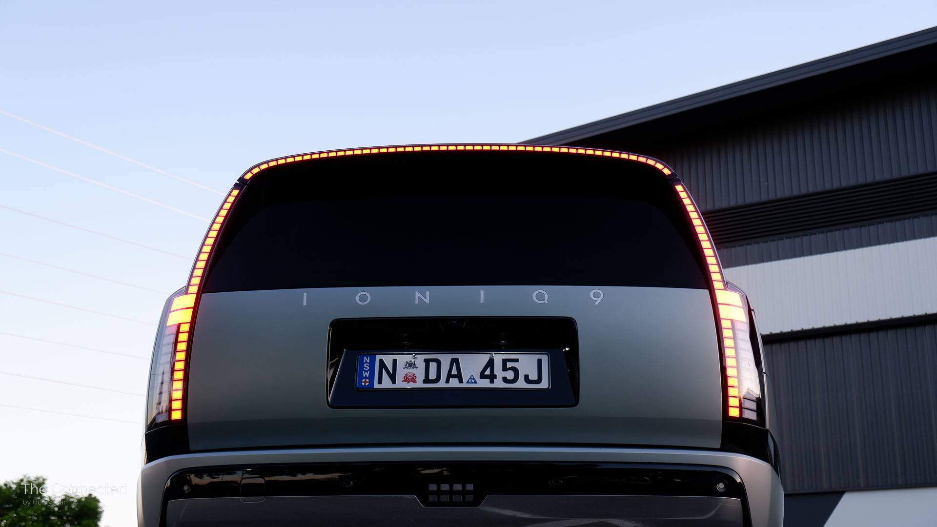2026 Hyundai Ioniq 9 Calligraphy rear brake light strip illuminated during the sunset