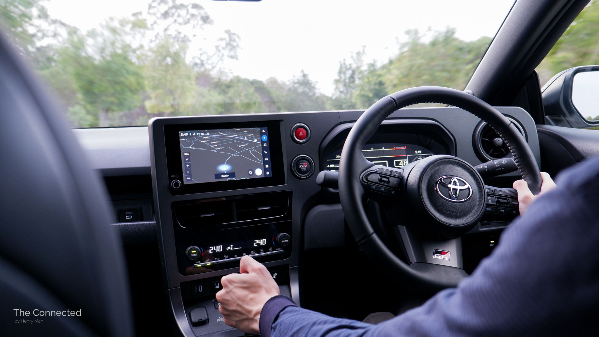Man driving the 2026 Toyota GR Yaris GT while holding the gear shifter