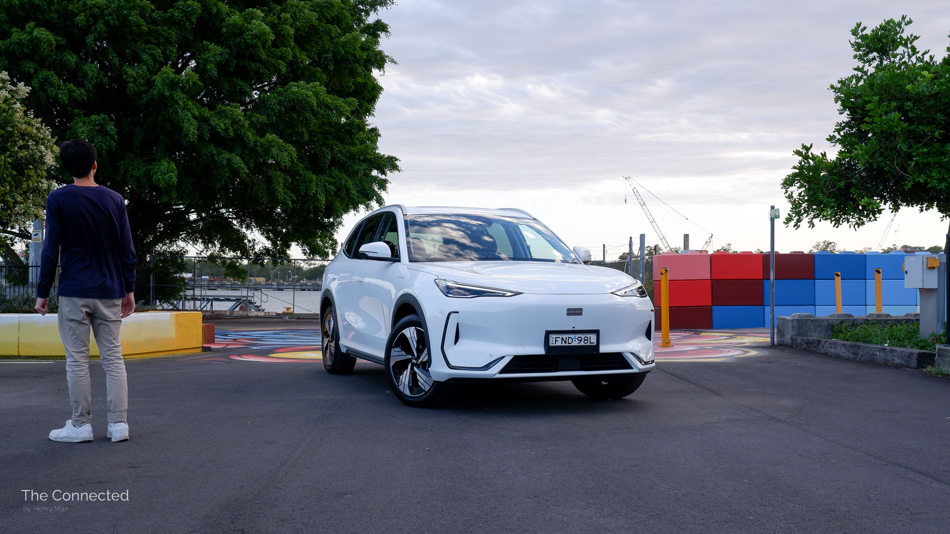 Man walks past the 2026 Geely EX5 Inspire