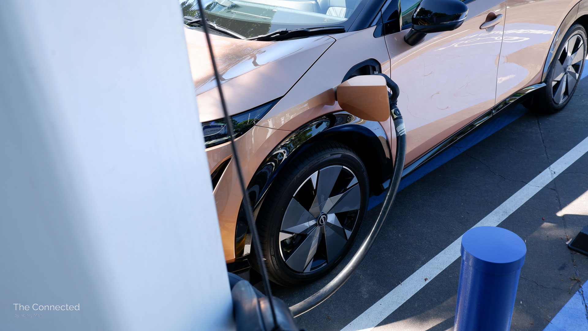 2026 Nissan Ariya Evolve e-4orce with charging cable plugged-in