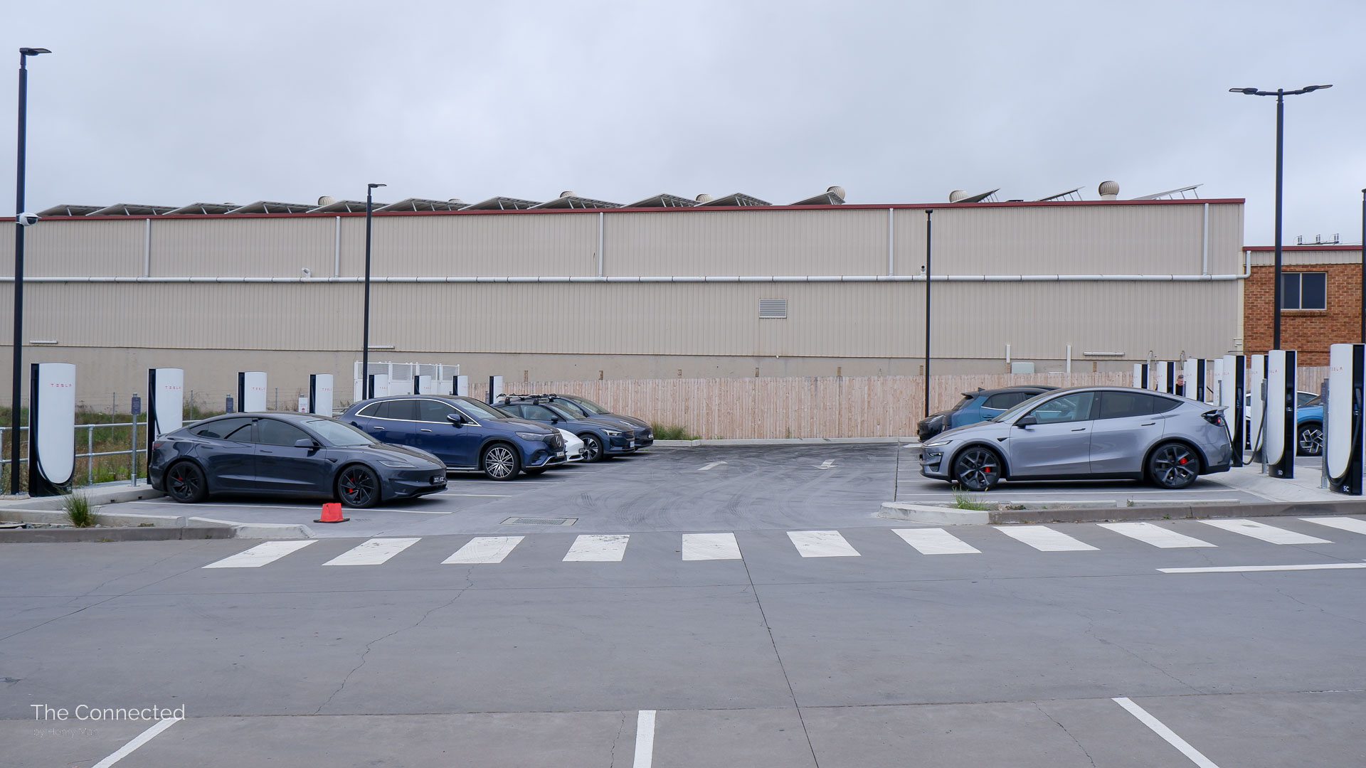 Electric vehicles charging at Goulburn, NSW Tesla Supercharger with Tesla Model 3 Performance and Model Y Performance in front