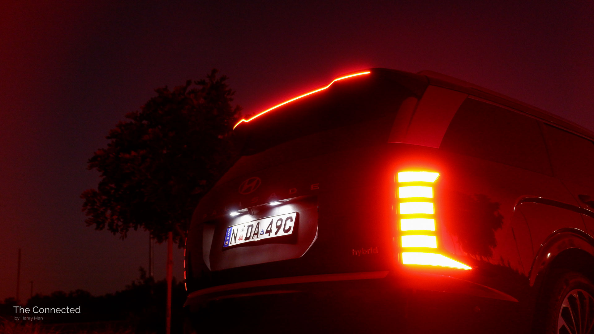 2026 Hyundai Palisade Calligraphy Hybrid rear brake lights illuminating at night