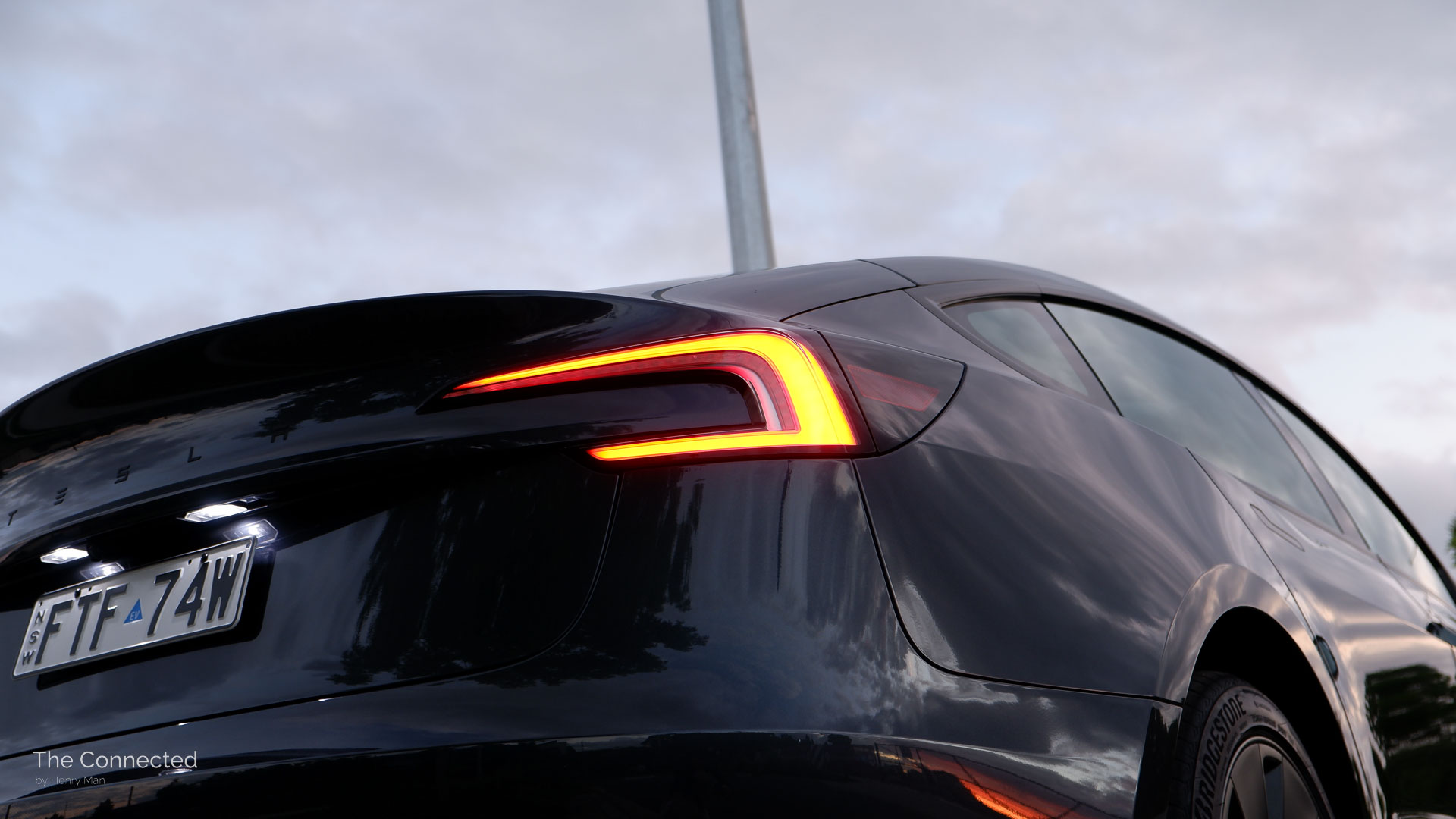 2026 Tesla Model 3 Premium Long Range RWD rear tail-light in the evening