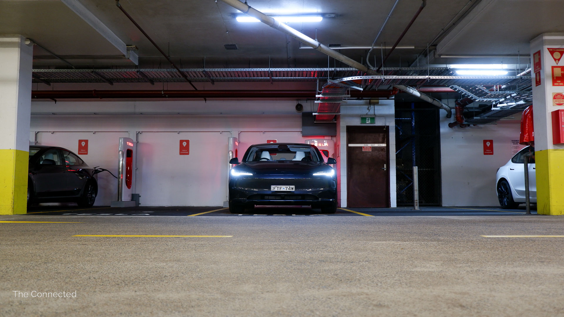 2026 Tesla Model 3 Premium Long Range RWD at undercover Tesla Supercharging station