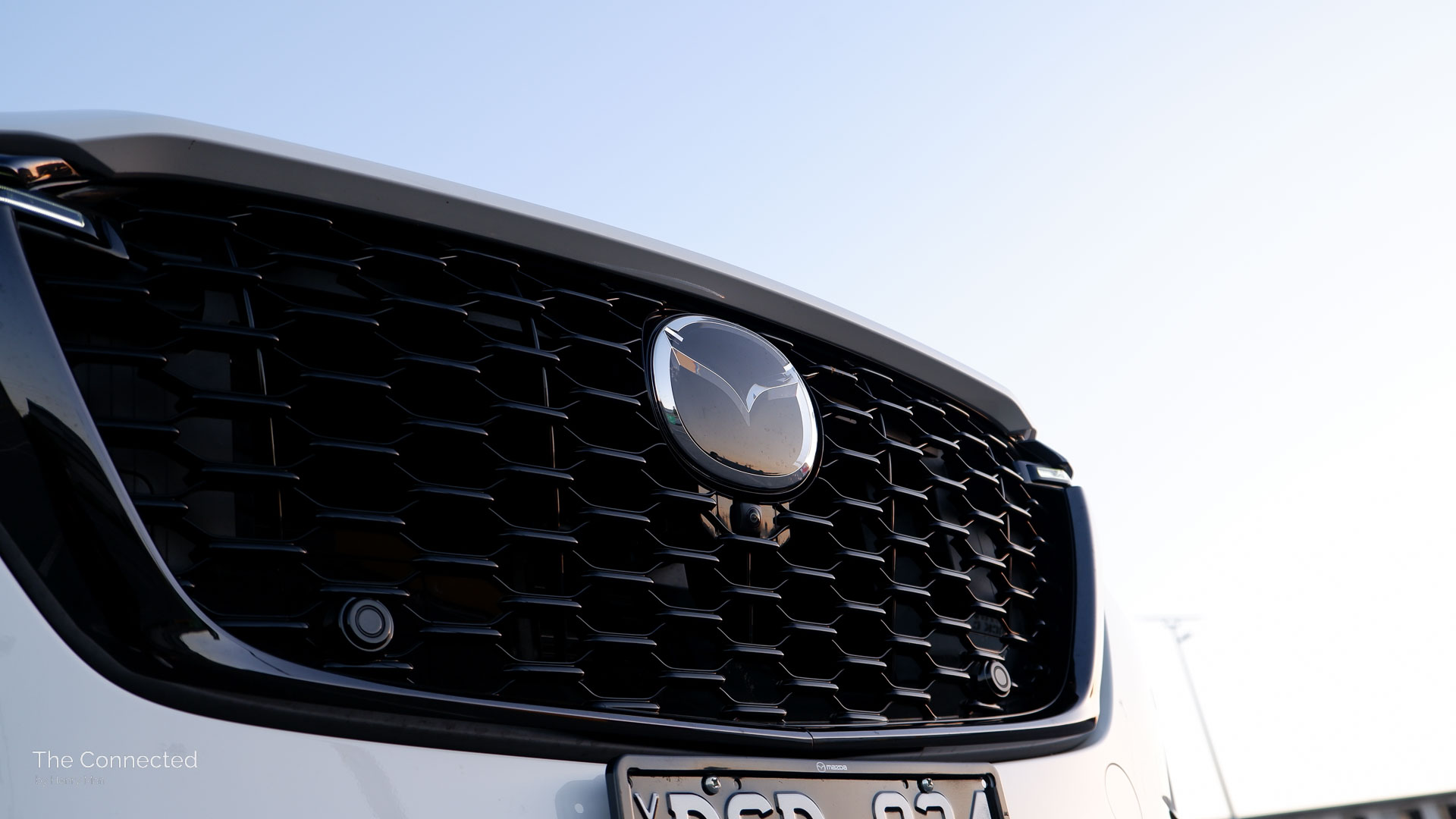 2026 Mazda CX-80 P50e Azami SP front grille with badge radar and parking sensors