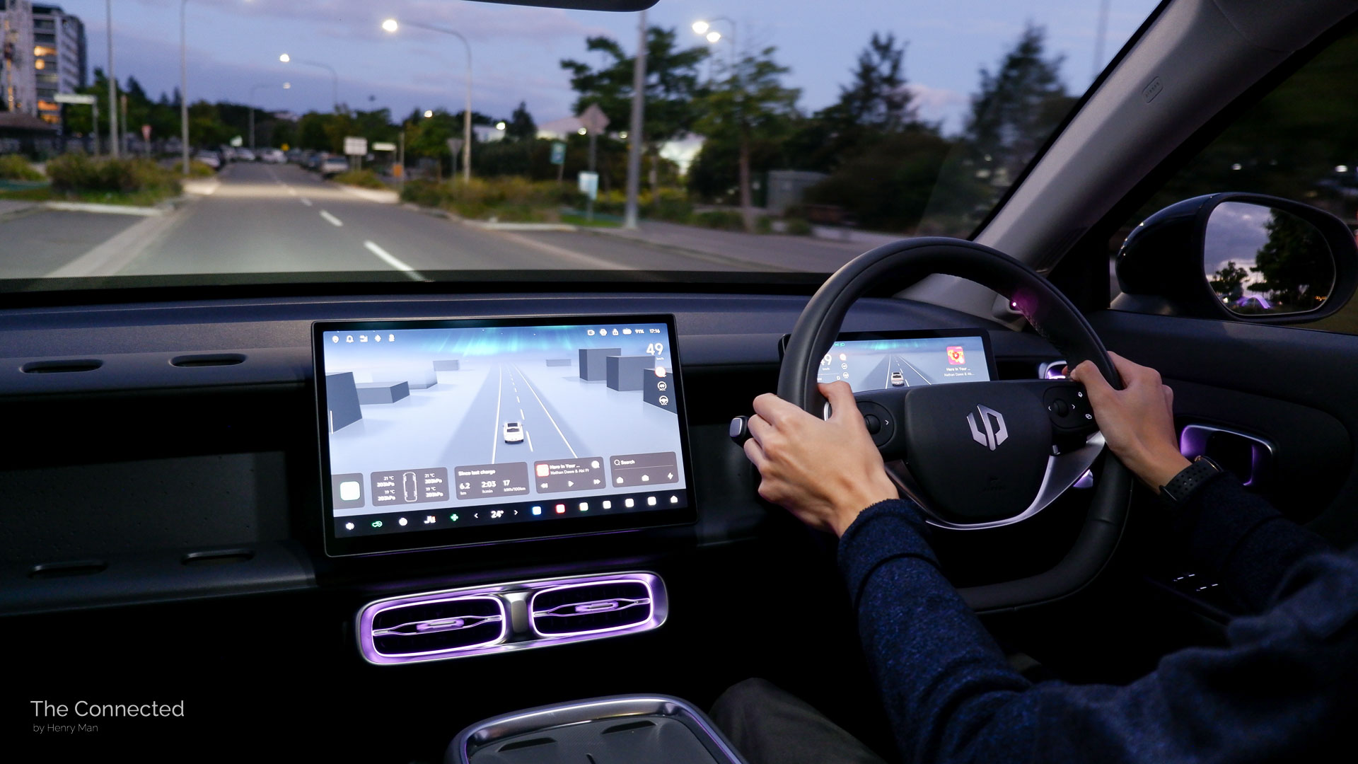 Man driving the 2026 Leapmotor B10 Design through a suburban street at night